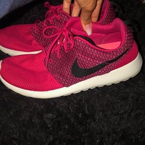 Pink Nike Roshe tennis shoes
